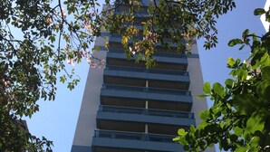 A high-rise building with multiple balconies and a sign indicating it is the Bristol Quarter Hotel. - Apart Quartier Latin Hotel (Vitoria)