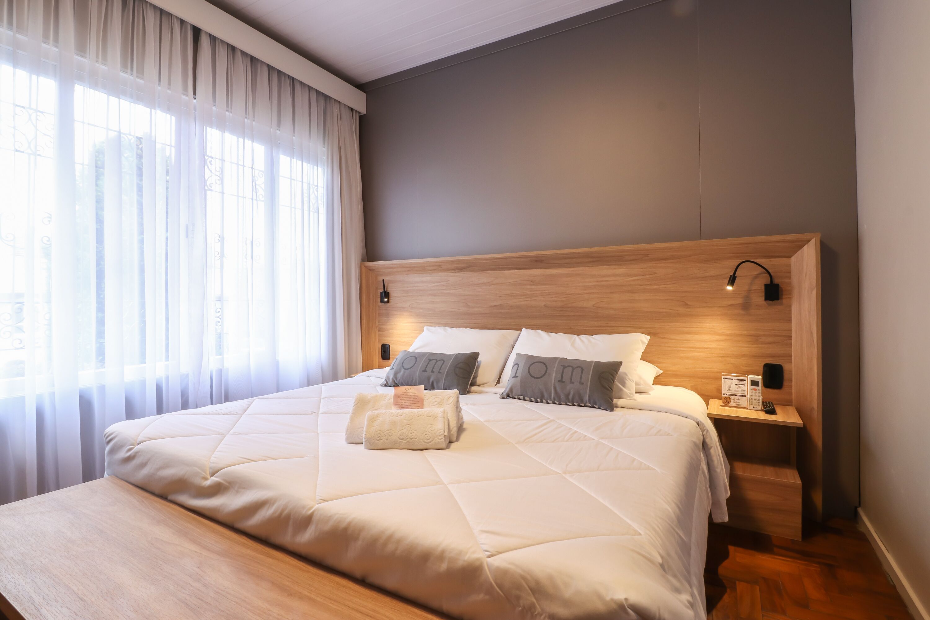 Deluxe Double or Twin Room | Minibar, desk, blackout drapes, iron/ironing board