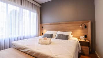 Deluxe Double or Twin Room | Minibar, desk, blackout drapes, iron/ironing board