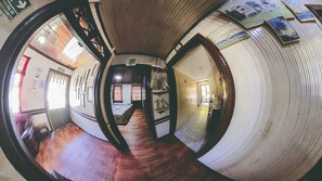 Basic Quadruple Room, Private Bathroom | Living area