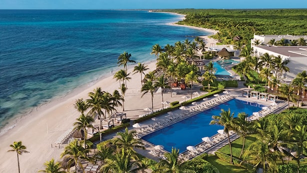 A resort with a large swimming pool, beach, and palm trees. - Dreams Tulum Resort & Spa - All Inclusive (Tulum)