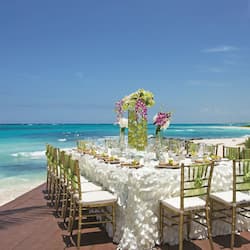 Enjoy an intimate outdoor dining experience on this beautifully set deck overlooking the ocean.