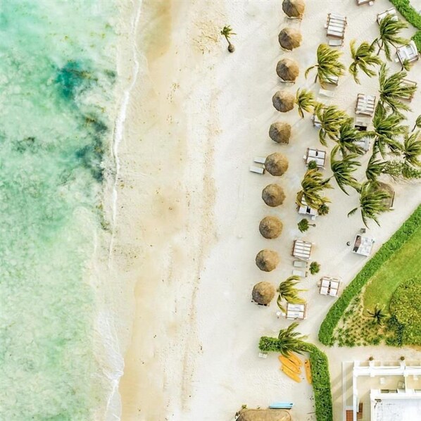 Private beach, white sand, free beach cabanas, sun loungers