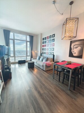 Executive Apartment, 1 Bedroom, Non Smoking, Park View | Living area | 42-inch flat-screen TV with cable channels, TV, DVD player - Monki-Di Executive Suites - Alura (Calgary)