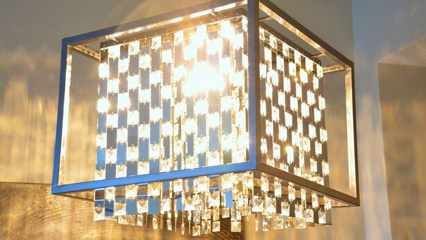 A chandelier with multiple square light fixtures. - Monki-Di Executive Suites - Alura (Calgary)