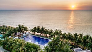 A resort with a swimming pool, beach, and palm trees. - Amarin Resort & Spa Phu Quoc (Phu Quoc)