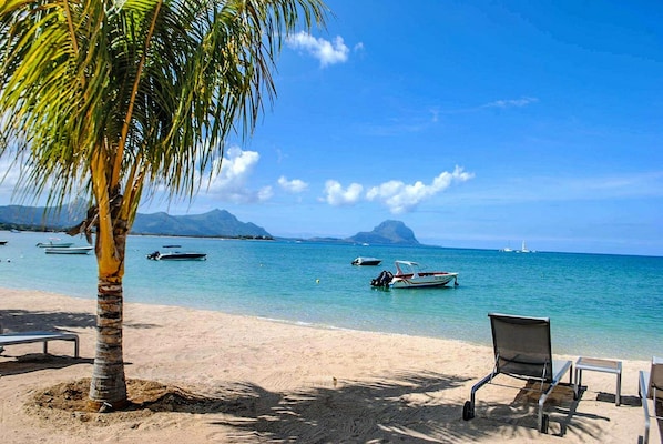 Private beach, beach umbrellas, beach towels