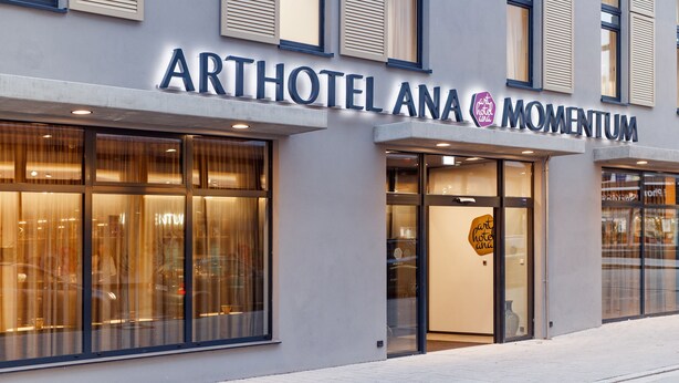 The exterior of the Arthouse Ana Momentum hotel with large glass windows and a modern facade. - elaya hotel goeppingen, Trademark Collection by Wyndham (Goeppingen)