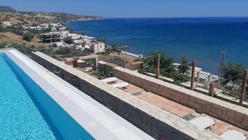 Seasonal outdoor pool, pool umbrellas, sun loungers