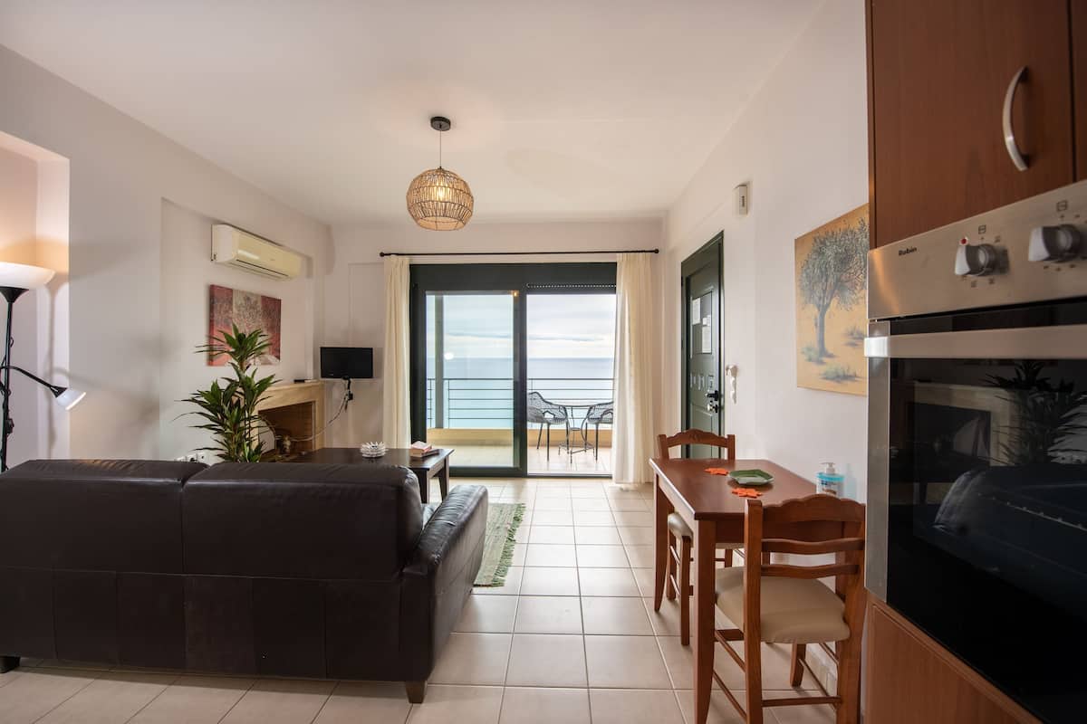 Apartment, 1 Bedroom, Sea View (2nd Floor A1/A2) | Living area | 43-inch Smart TV with satellite channels