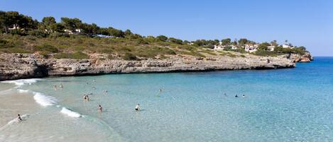 Beach nearby, white sand, sun loungers, beach umbrellas