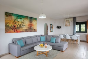 Comfort Villa, Sea View (Portela House 2) | Living area | 42-inch flat-screen TV with satellite channels, TV, offices