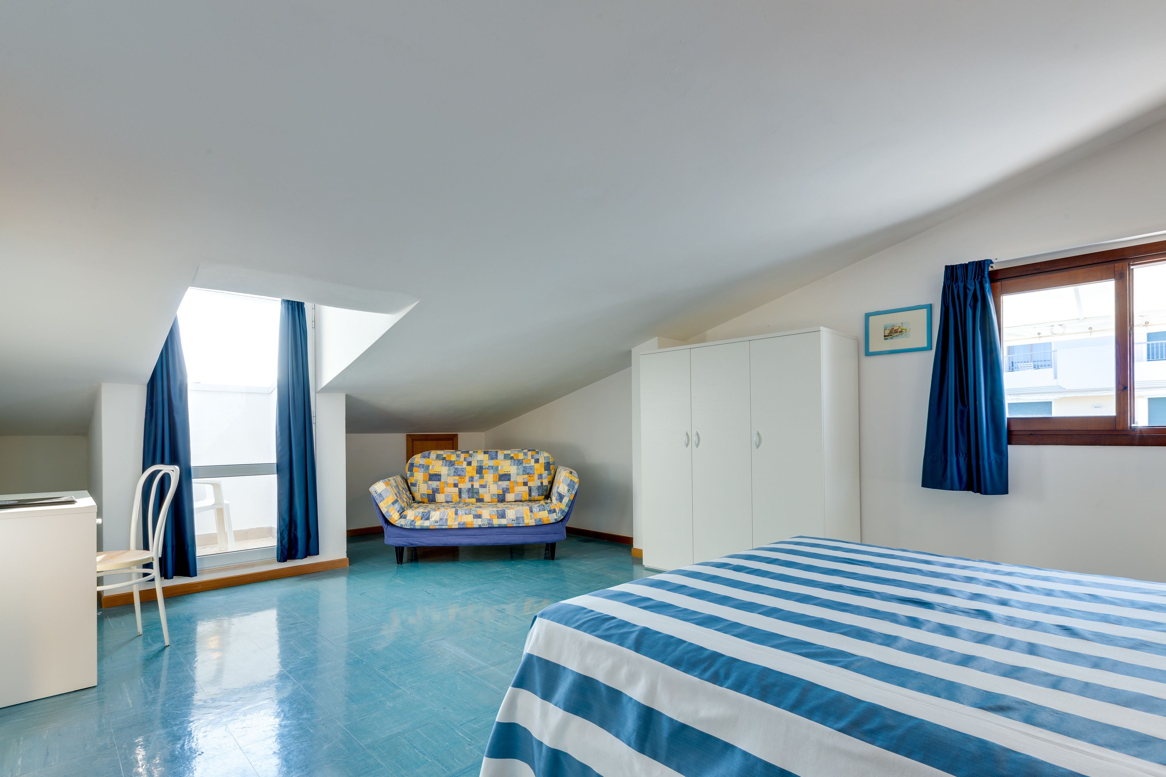 economy triple room (mansarda) | 1 bedroom, pillow-top beds, minibar, in-room safe