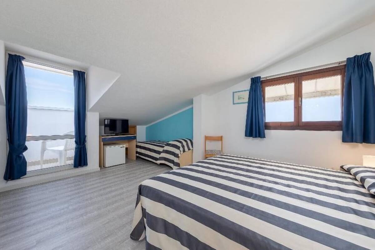 Economy Quadruple Room | 1 bedroom, pillowtop beds, minibar, in-room safe