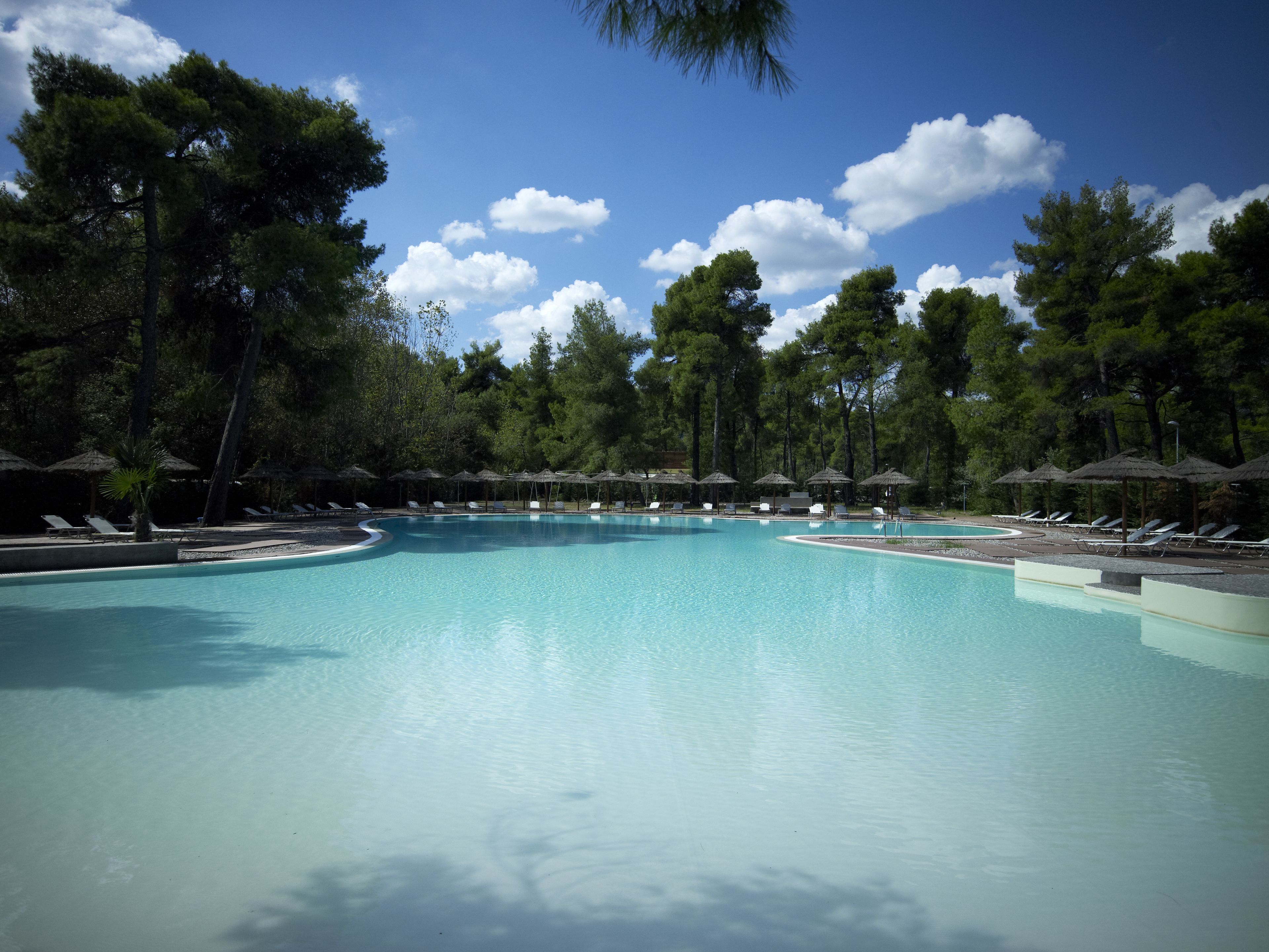 seasonal outdoor pool, pool umbrellas, pool loungers