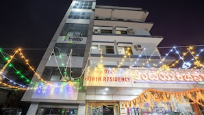 A multi-story building with a sign for 'Treebo' and 'Vijaya Residency'. - Itsy Hotels Vijaya Residency (Udupi)