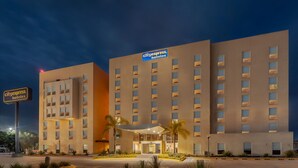 A CityExpress Hotel building with a modern facade, multiple floors, and a well-lit entrance. - City Express by Marriott Celaya Galerias (Celaya)