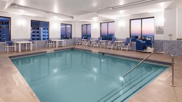 Indoor pool, open 9:00 AM to 10:00 PM, pool loungers