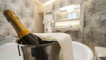 Romantic Suite, Bathtub | Bathroom amenities | Free toiletries, hair dryer, slippers, towels