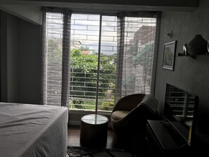 Deluxe Studio Suite, 1 King Bed, Refrigerator & Microwave, Mountain View | Courtyard view - Abacus Jamaica the Zana Suite (Kingston)