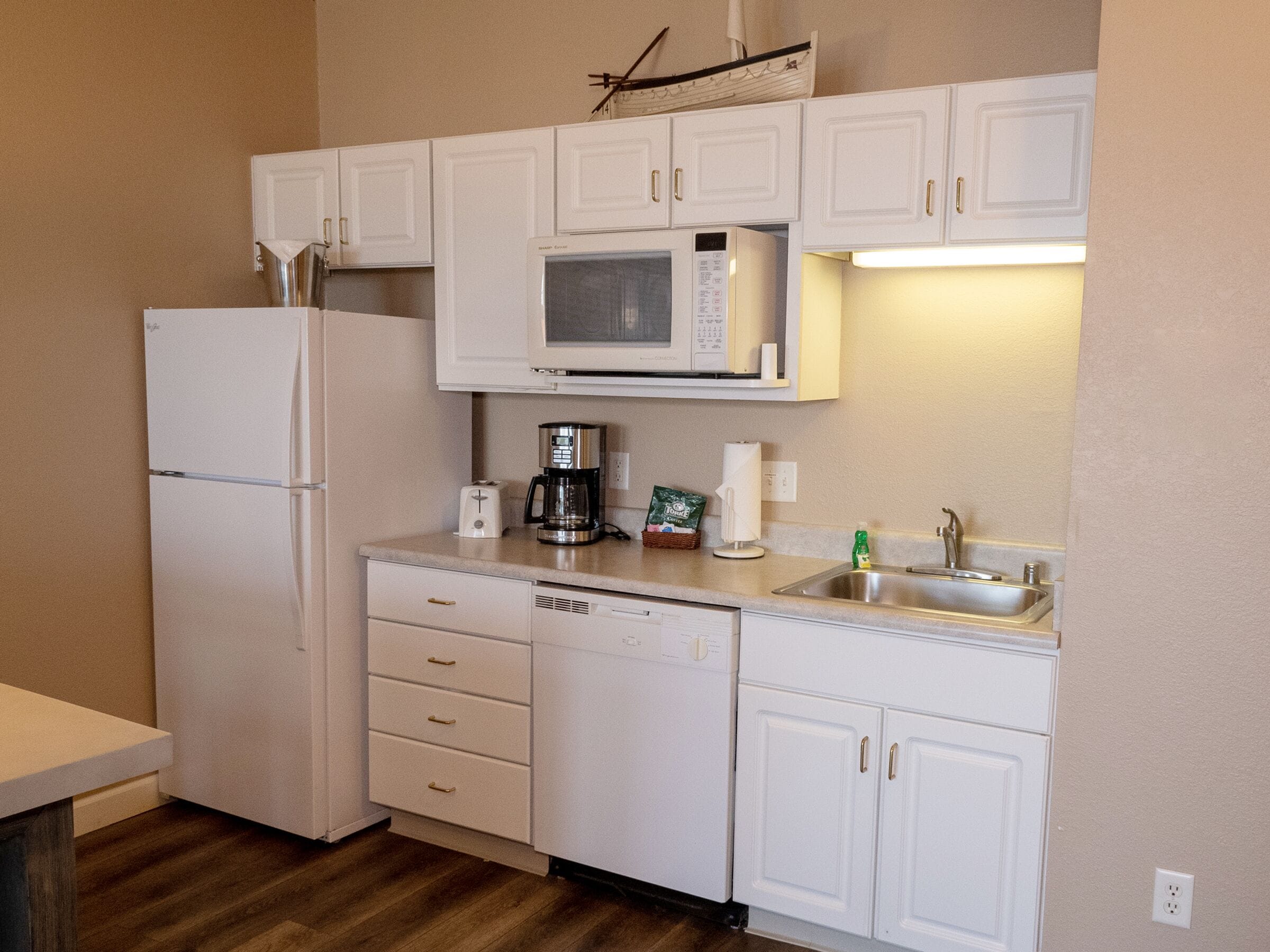 suite, 1 bedroom, lake view | private kitchenette | full-sized fridge, microwave, dishwasher, coffee/tea maker