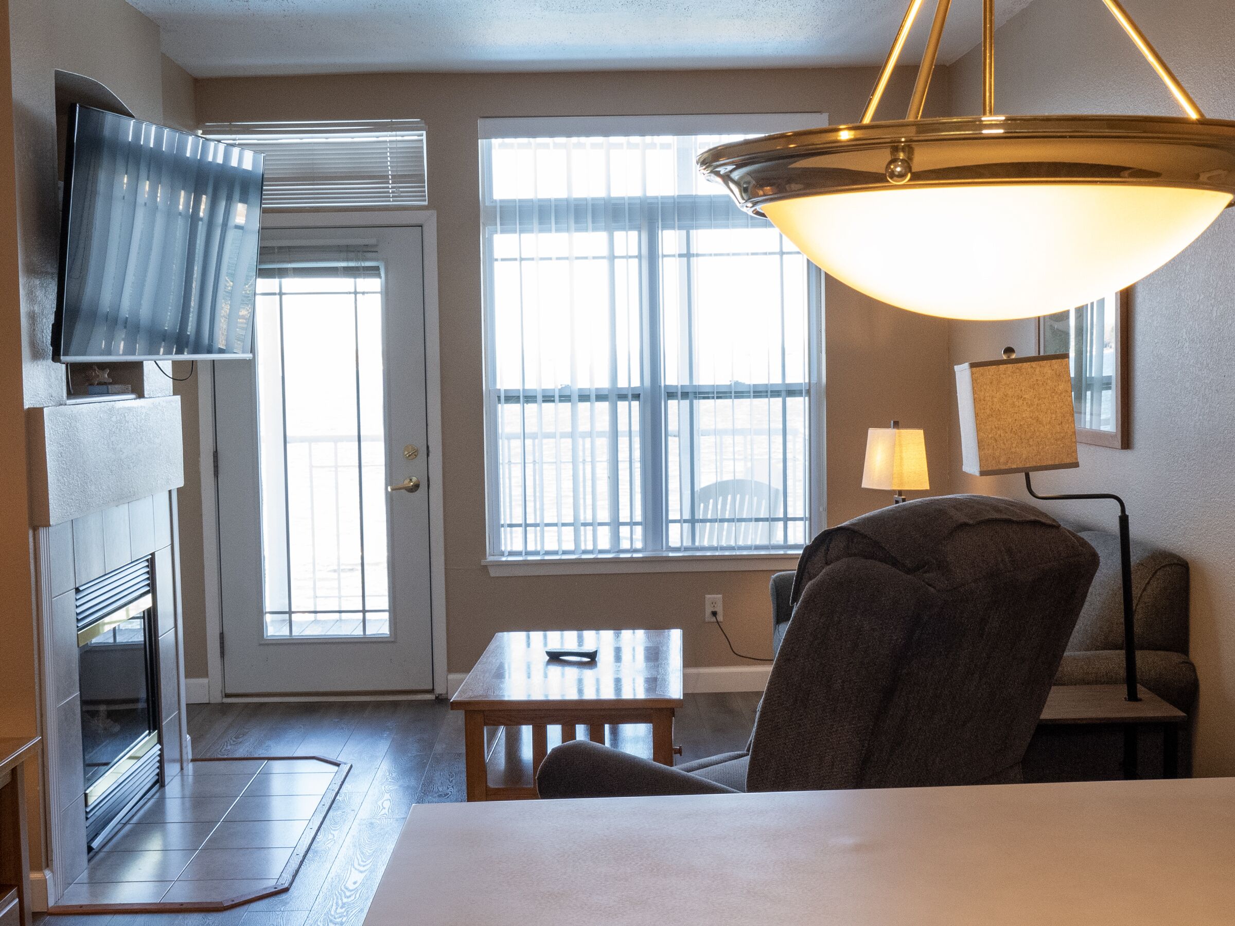 suite, 1 bedroom, lake view | living area | tv, fireplace