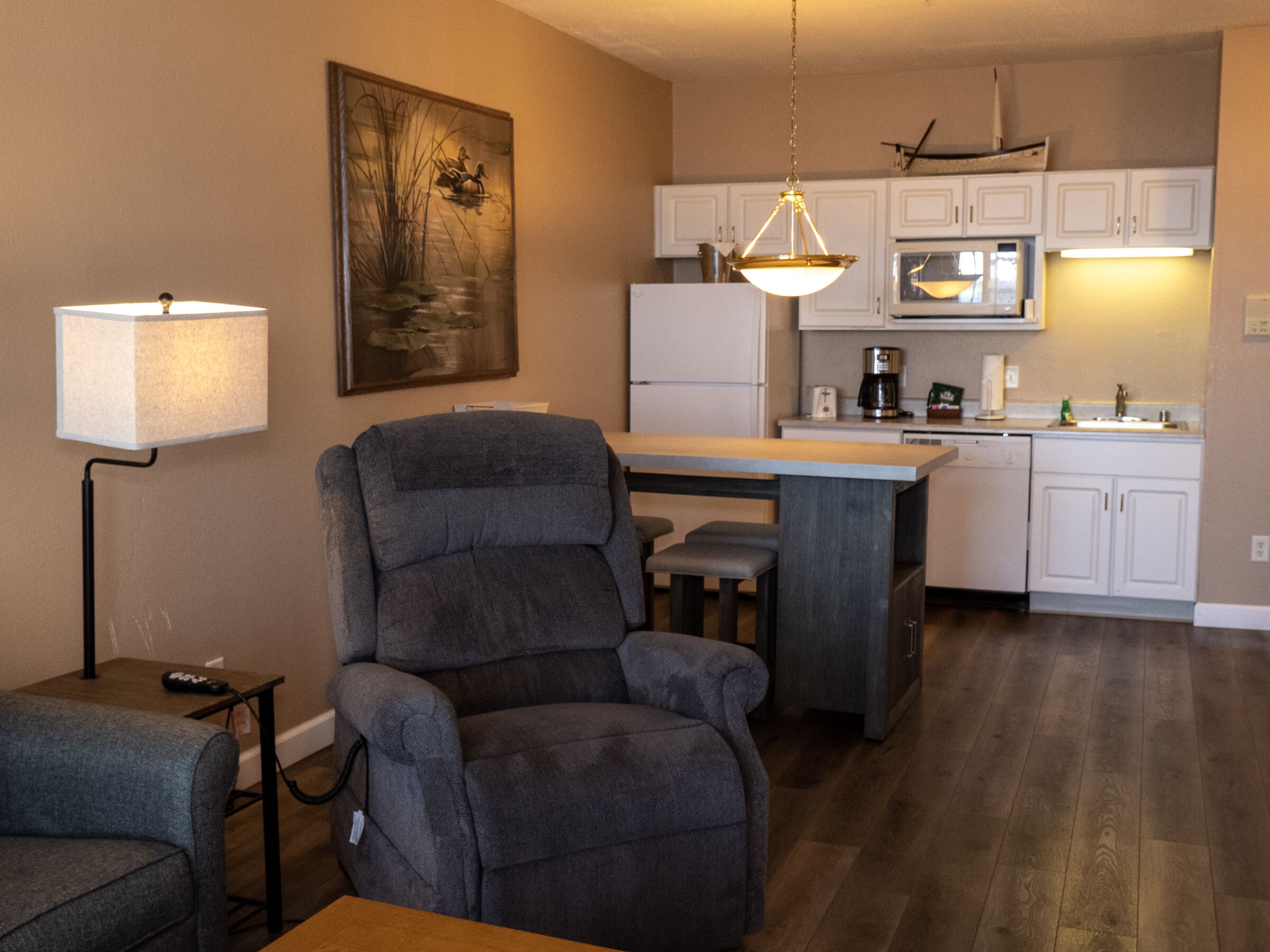 suite, 1 bedroom, lake view | living area | tv, fireplace