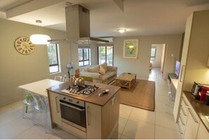 2 Bedroom Delux Apartment | Living room | 49-inch flat-screen TV with satellite channels, Smart TV, Netflix - The Hub (Sandton)