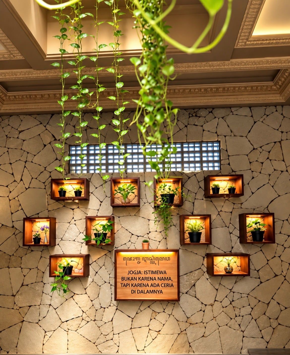 A wall with multiple wooden shelves holding potted plants and a sign with text.