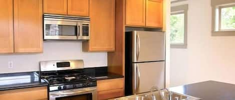 Deluxe Suite, 2 Bedrooms | Private kitchen | Fridge, microwave, oven, stovetop