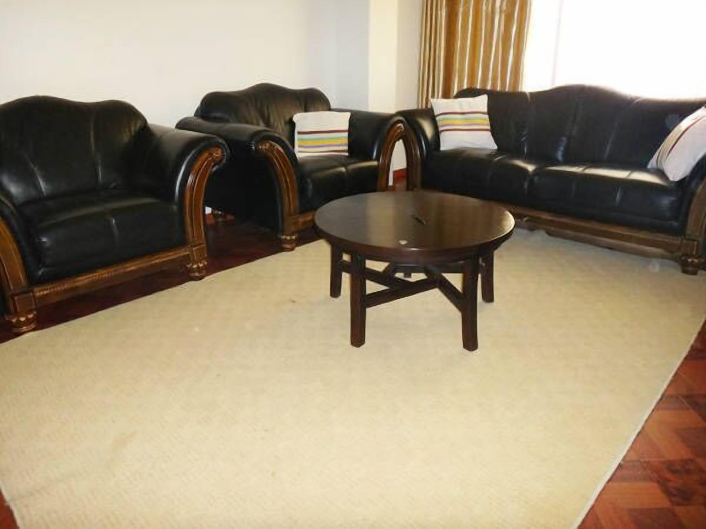 deluxe suite, 2 bedrooms | living area | flat-screen tv