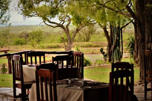 Breakfast, lunch served; local and international cuisine, garden views 