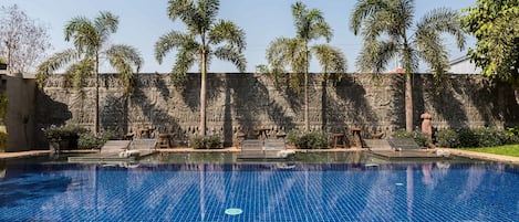 Outdoor pool, open 7:00 AM to 9:30 PM, pool umbrellas, pool loungers