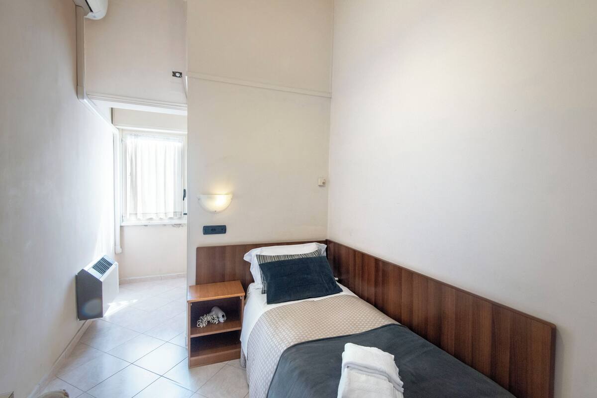 Economy Single Room | Down comforters, desk, laptop workspace, WiFi (free)