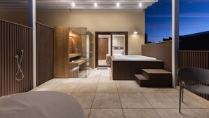 A modern, well-lit bedroom with a large bed, a walk-in closet, and a bathroom with a glass shower enclosure. - The Duke Boutique Hotel (Victoria)