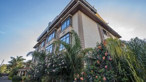A multi-story building with large windows and a balcony. - Fair Acres Boutique Hotel (Nairobi)