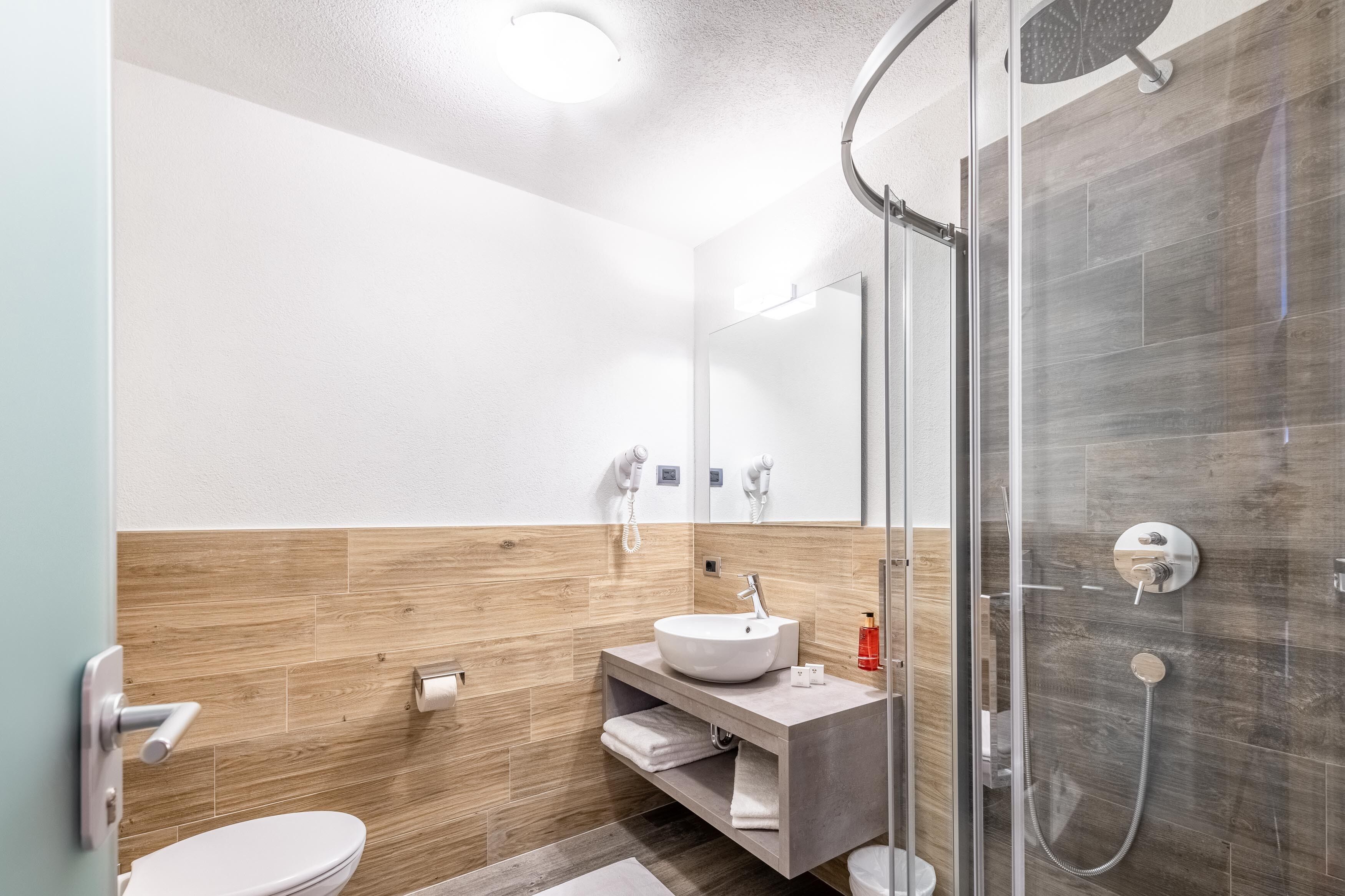 superior triple room | bathroom | hair dryer, bidet, towels, soap