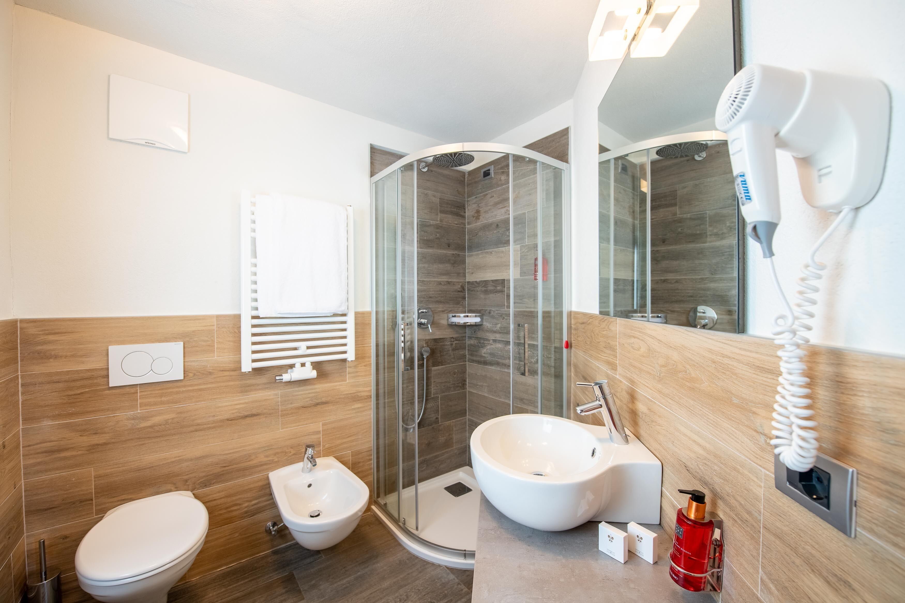 superior double or twin room | bathroom | hair dryer, bidet, towels, soap