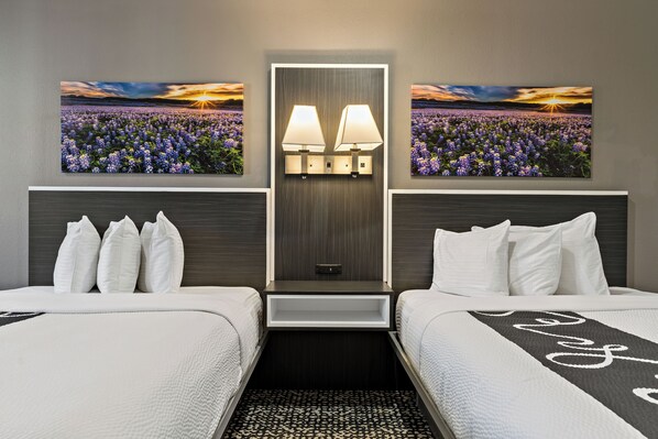Deluxe Suite, 2 Queen Beds | Hypo-allergenic bedding, down comforters, desk, blackout drapes