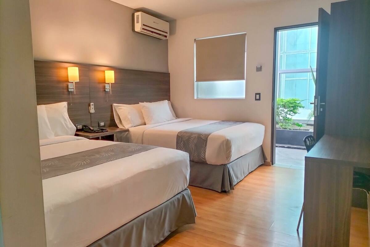 superior room, 2 queen beds | down duvets, individually decorated, iron/ironing board, free wifi