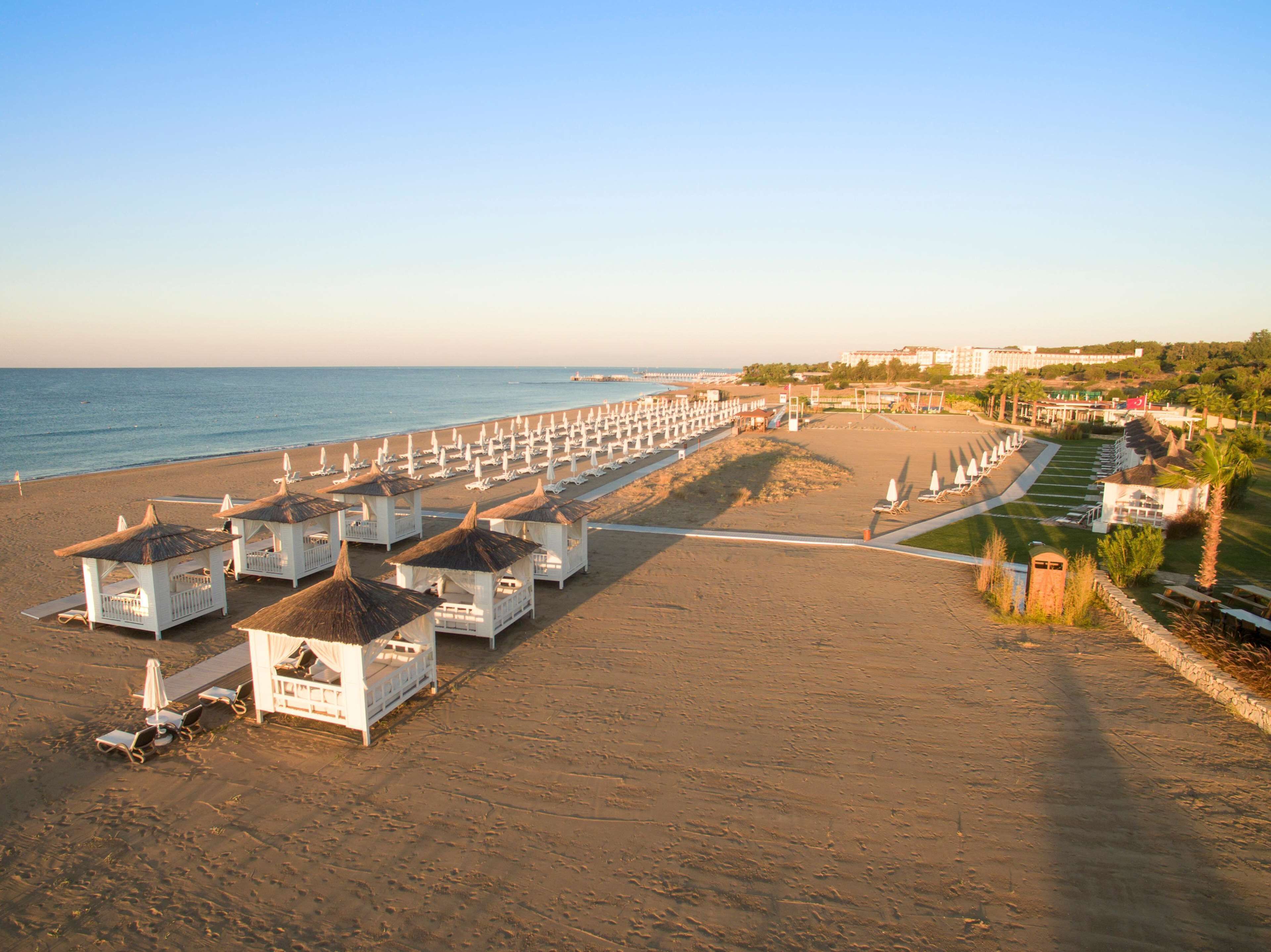 On the beach, sun loungers, beach umbrellas, beach towels