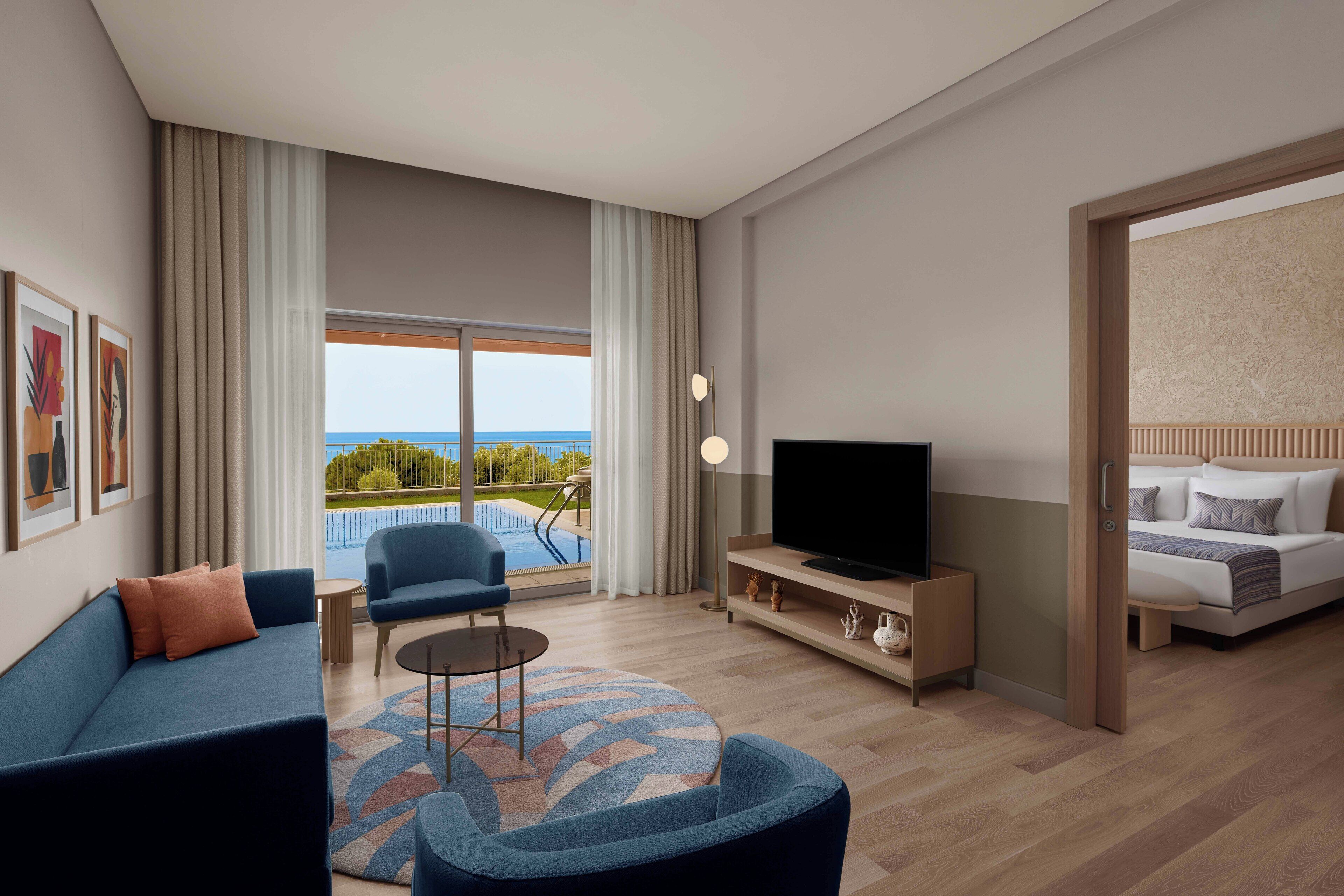 Suite, Private Pool (Adult) | Minibar, in-room safe, desk, iron/ironing board