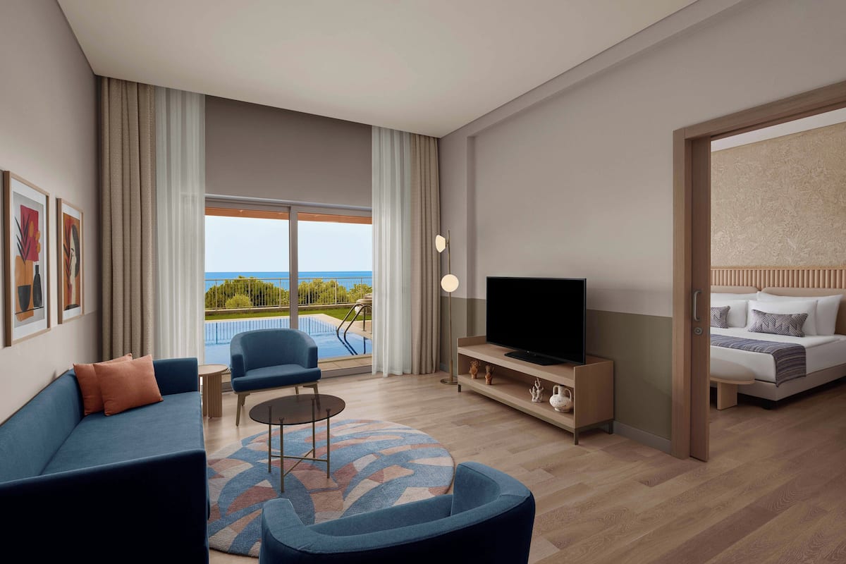 Suite, Private Pool (Adult) | Minibar, in-room safe, desk, iron/ironing board