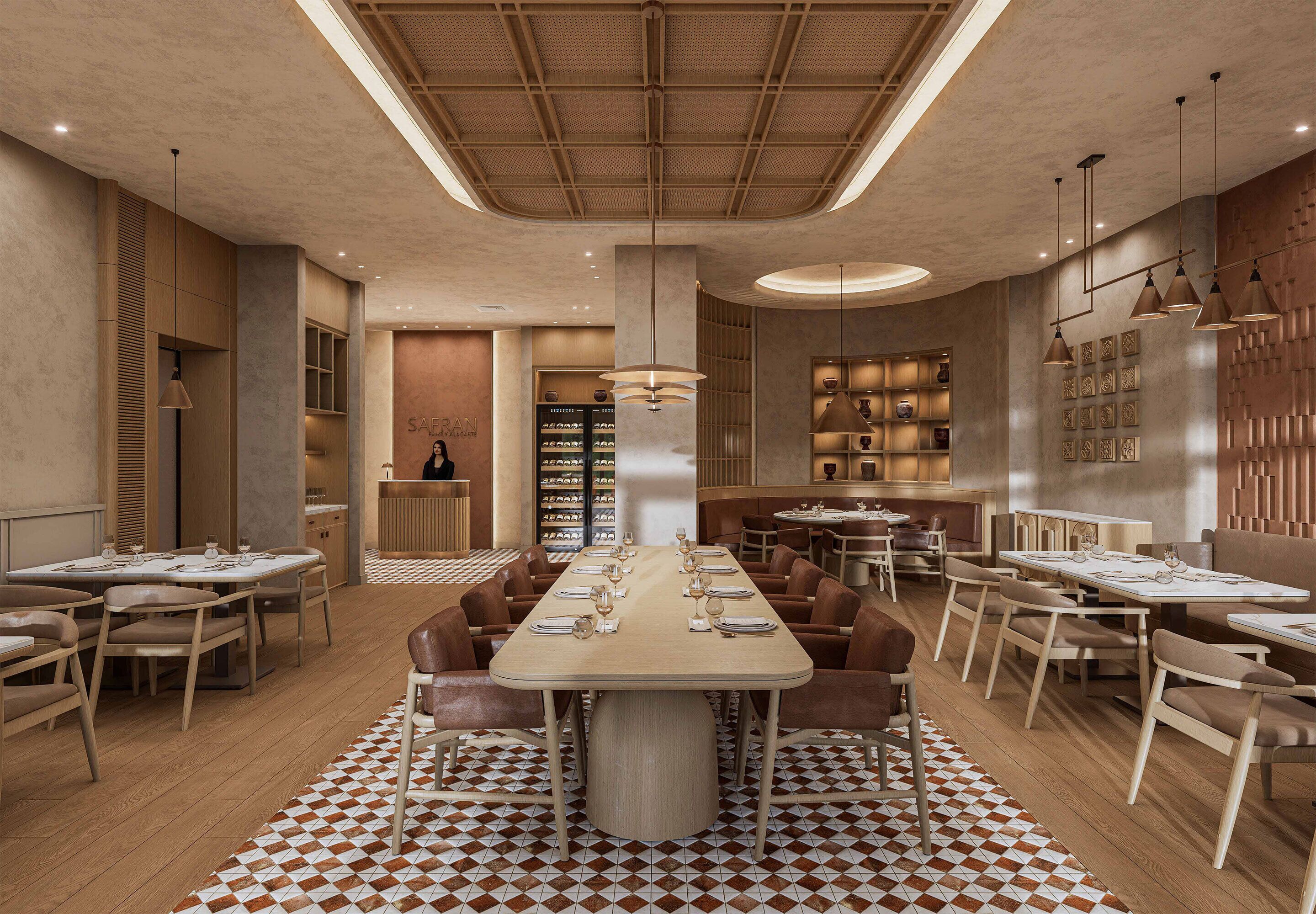 Un restaurante espacioso con una mesa central, diversas disposiciones de asientos y un suelo estampado.
