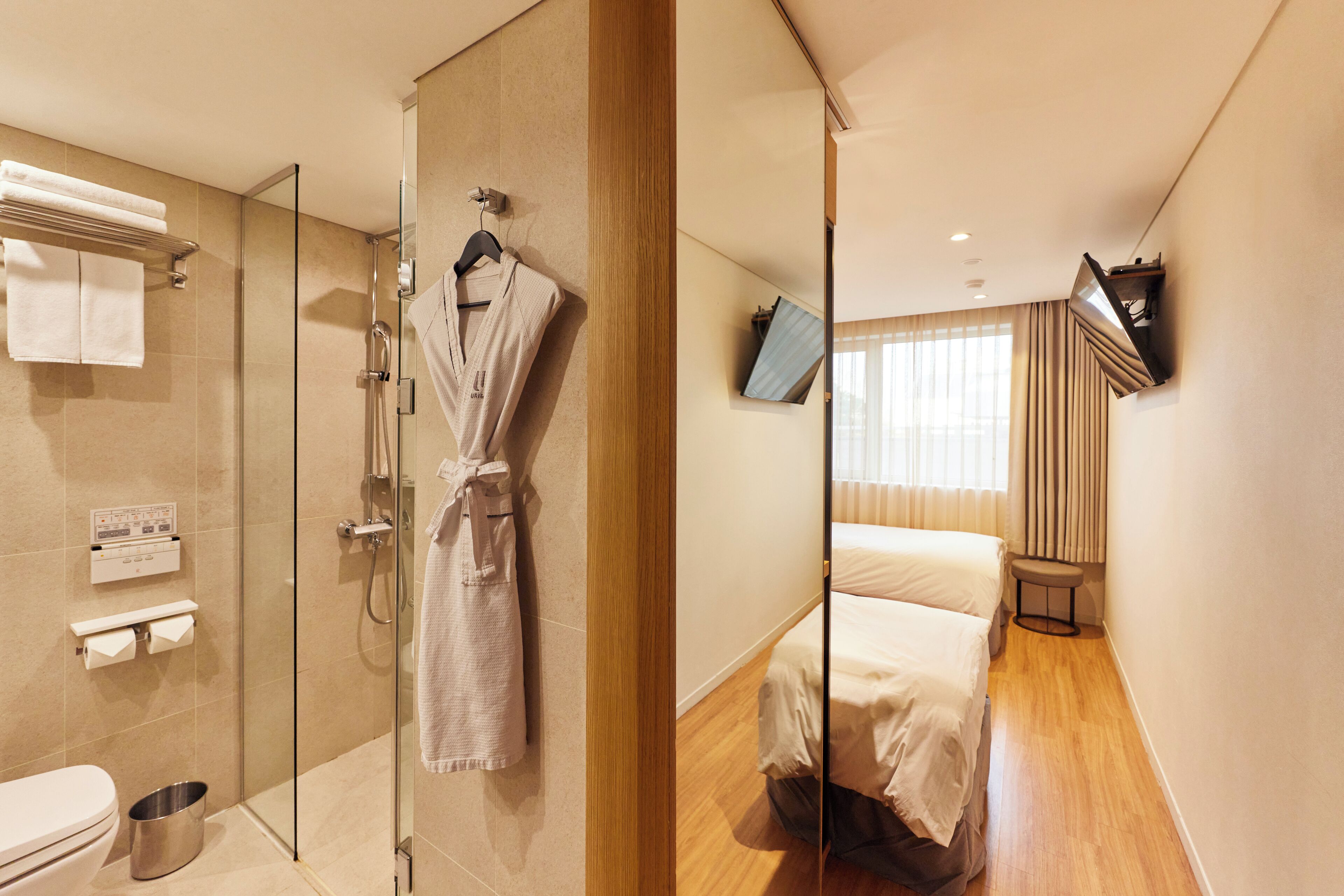 superior twin room | bathroom | hair dryer, bathrobes, bidet, towels