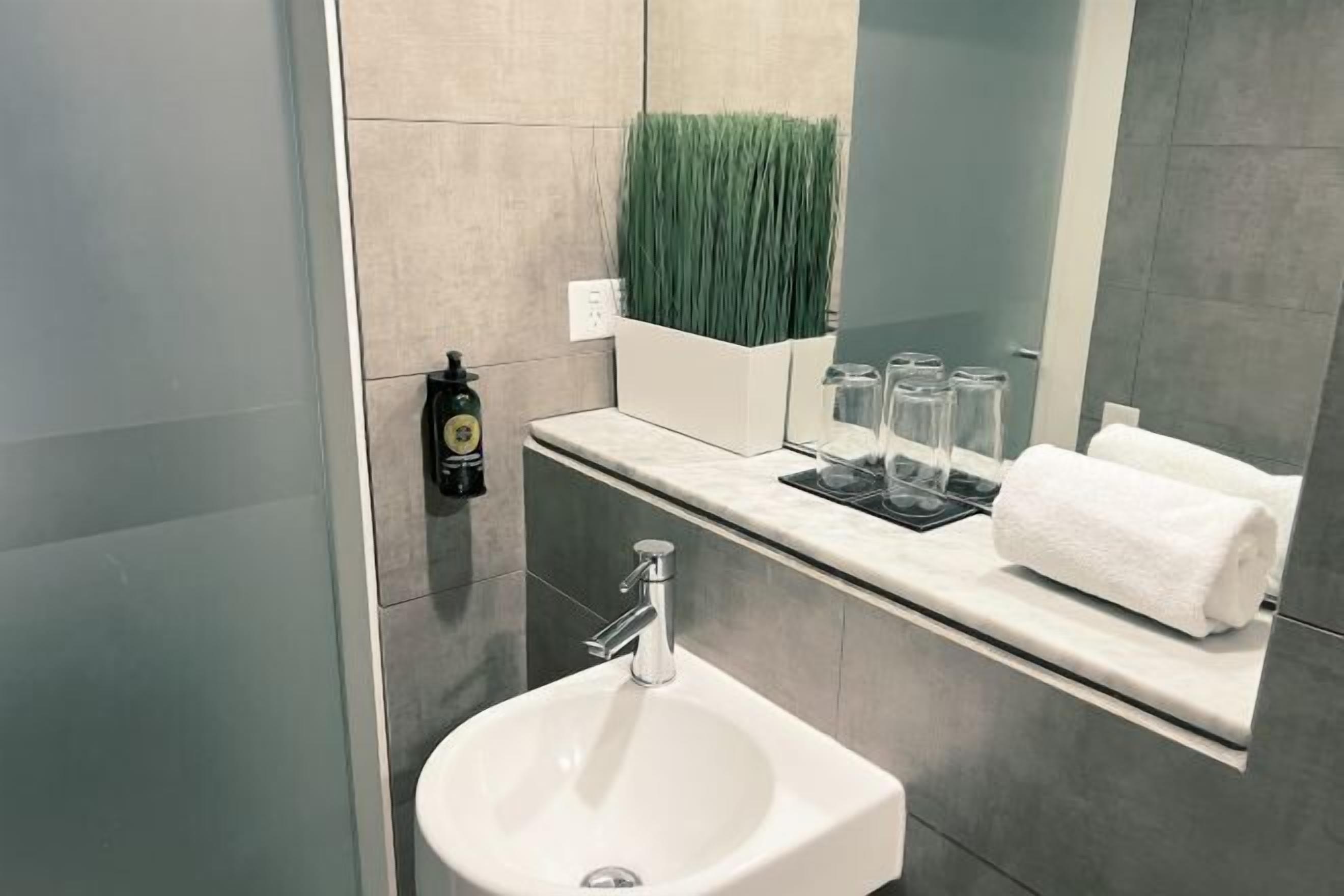 Bathroom | Shower, designer toiletries, hair dryer, towels