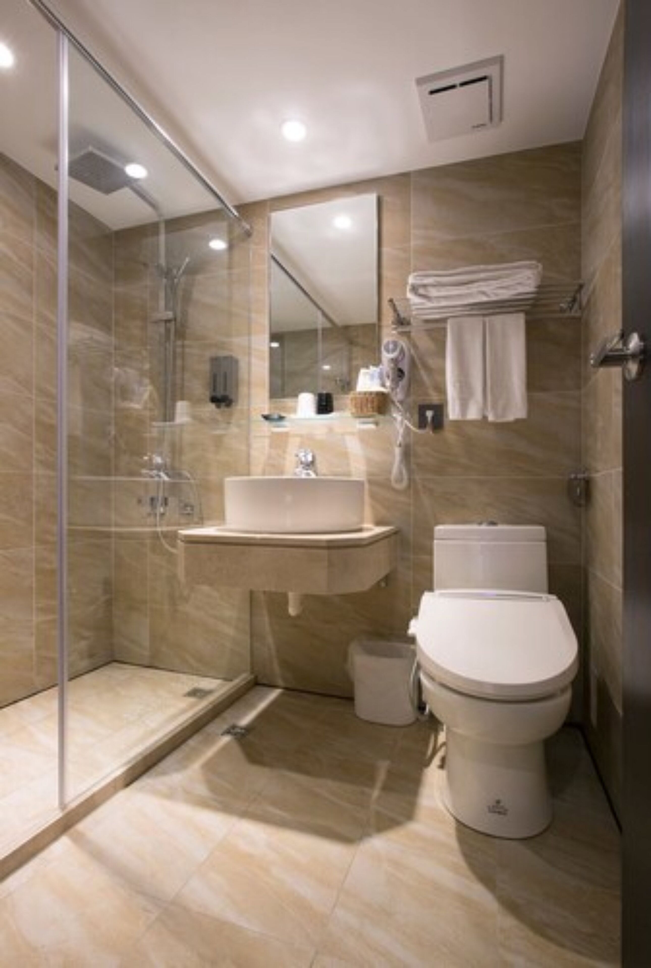 hair dryer, slippers, bidet, towels