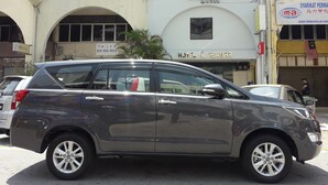 A hotel with a sign reading "Hotel Al Abraar" and a visible contact number. - Hotel Al Abraar (Malacca City)