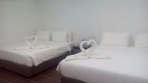 Two twin beds with heart-shaped towels on the beds. - Hotel Al Abraar (Malacca City)