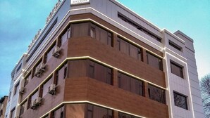 A multi-story hotel with a modern design, featuring a prominent 'SAYYOH' sign at the entrance. - Sayyoh Hotel (Tashkent)